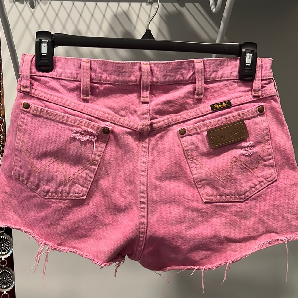 Faded pink cut off high waisted wranglers